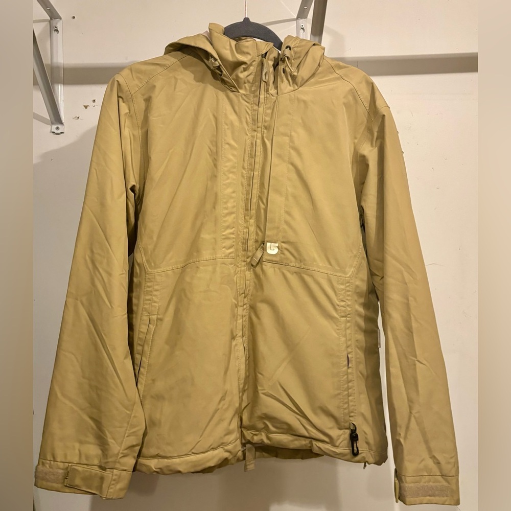 Burton Ski/Snowboard Tan colored jacket sized Medium with pink colored interior.